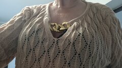 W nowym swetrze z dekoltem....